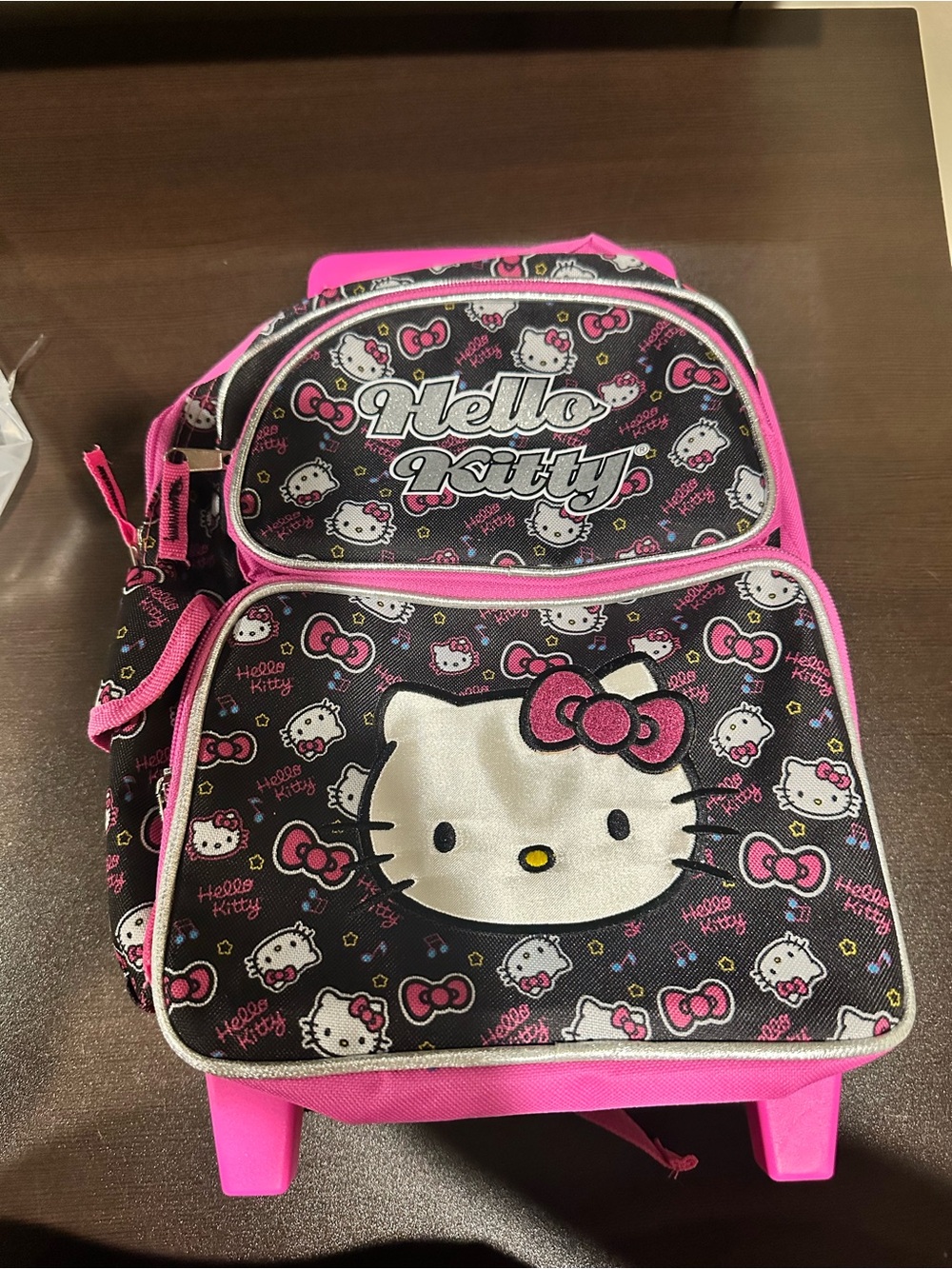 Hello Kitty Black and Pink Rolling Kids Backpack